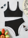 Women’s halter swimsuit with cutout design and lace-up detail
