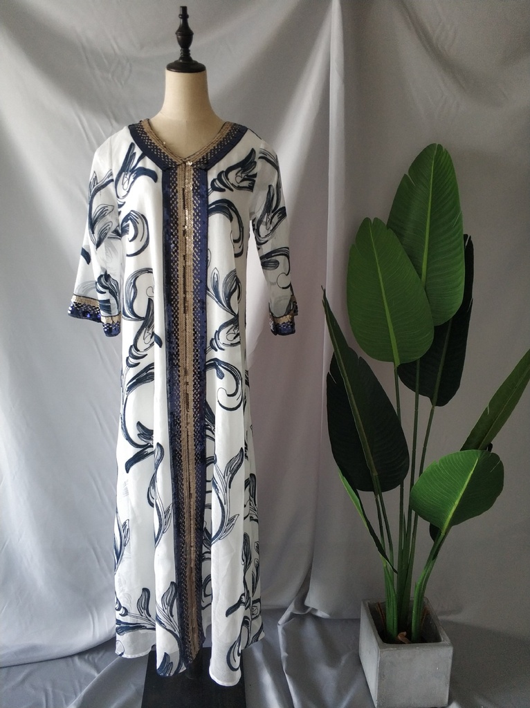 An elegant and distinctive kaftan dress embroidered with a design inspired by Islamic heritage fashion 