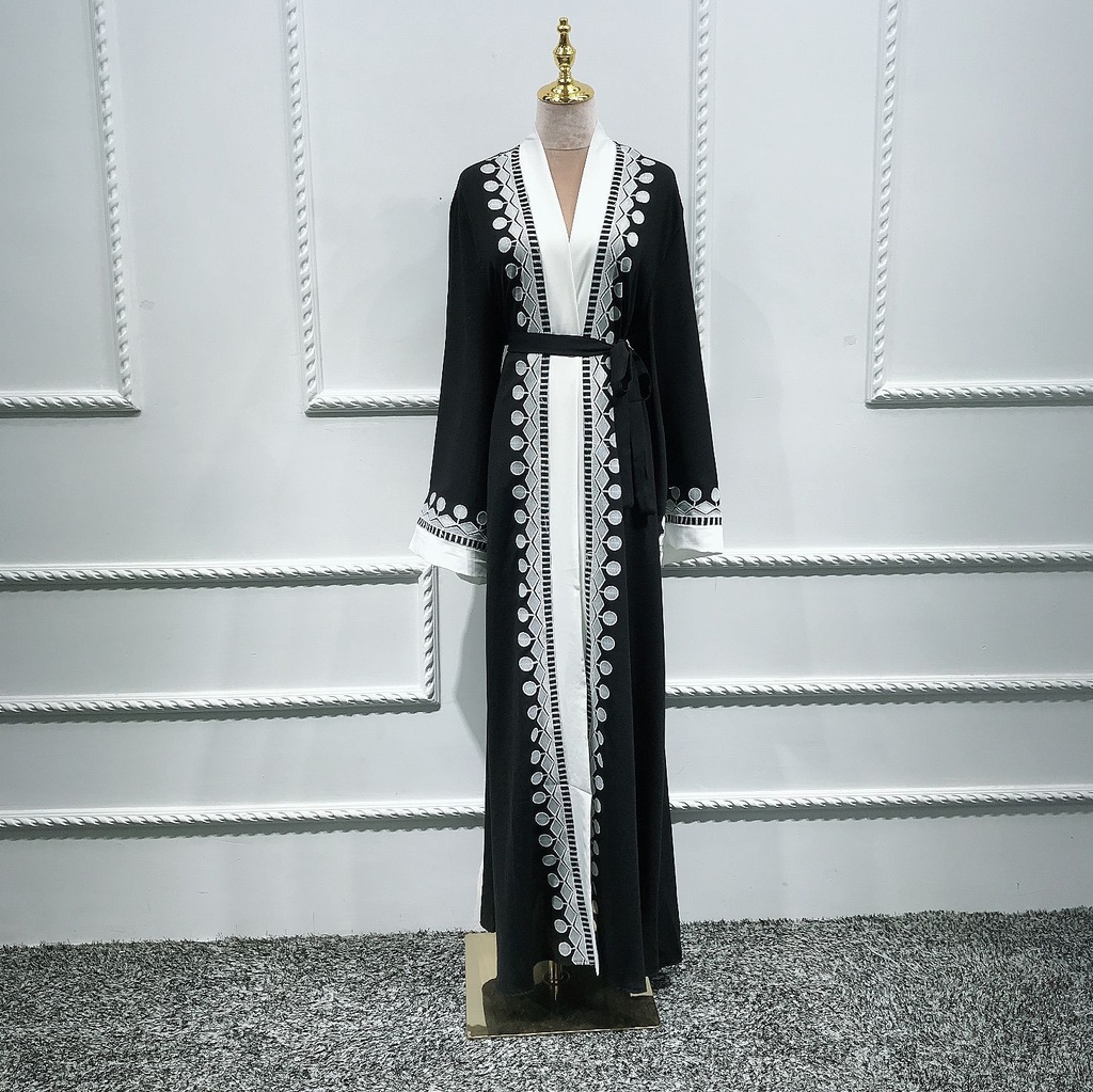 A women's abaya with an embroidered cardigan design inspired by Islamic and Eastern heritage