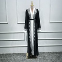 A women's abaya with an embroidered cardigan design inspired by Islamic and Eastern heritage