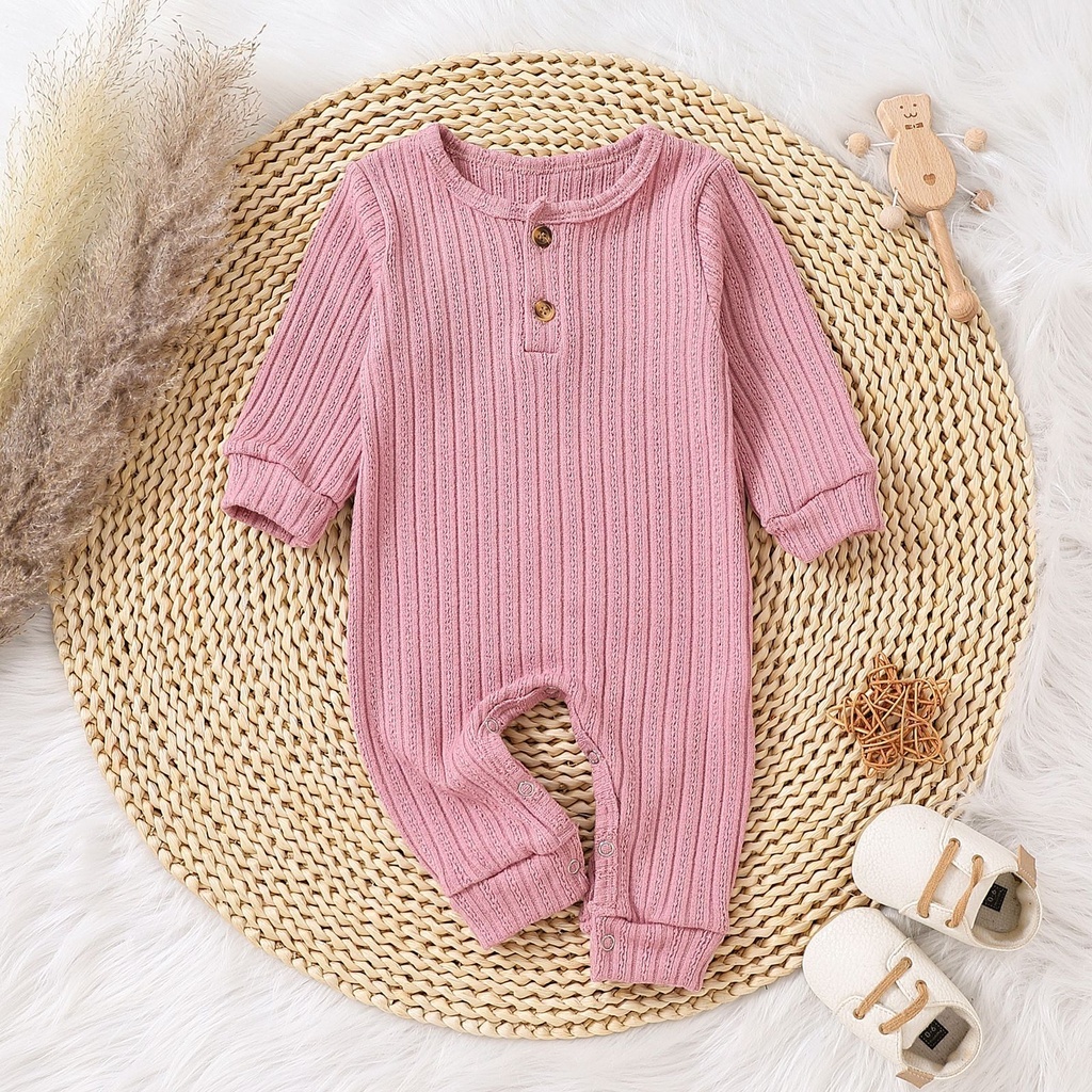A multicolored knitted romper for children, showcasing a distinctive elegance and modern style 