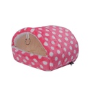 A warm and cozy house for small pets, elegantly designed and lined with soft fur to provide comfort and warmth 