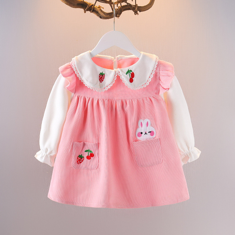 A fall dress with a unique cartoon design adorned with cherry prints, combining elegance and a playful touch 