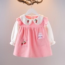 A fall dress with a unique cartoon design adorned with cherry prints, combining elegance and a playful touch 