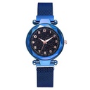 A luminous quartz watch with a digital face inspired by a sky full of stars