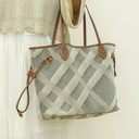 A stylish and spacious shoulder bag made from durable canvas, perfect for daily use and carrying all your essentials with ease