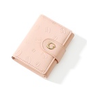 A compact women's wallet with a foldable design, combining elegance and functionality