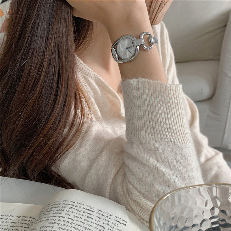 Women's watch with an elegant artistic design, featuring a stylish dial and a steel strap