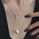 An elegant and stylish necklace featuring a round ball ring design, perfect for adding personality and a unique touch to your look
