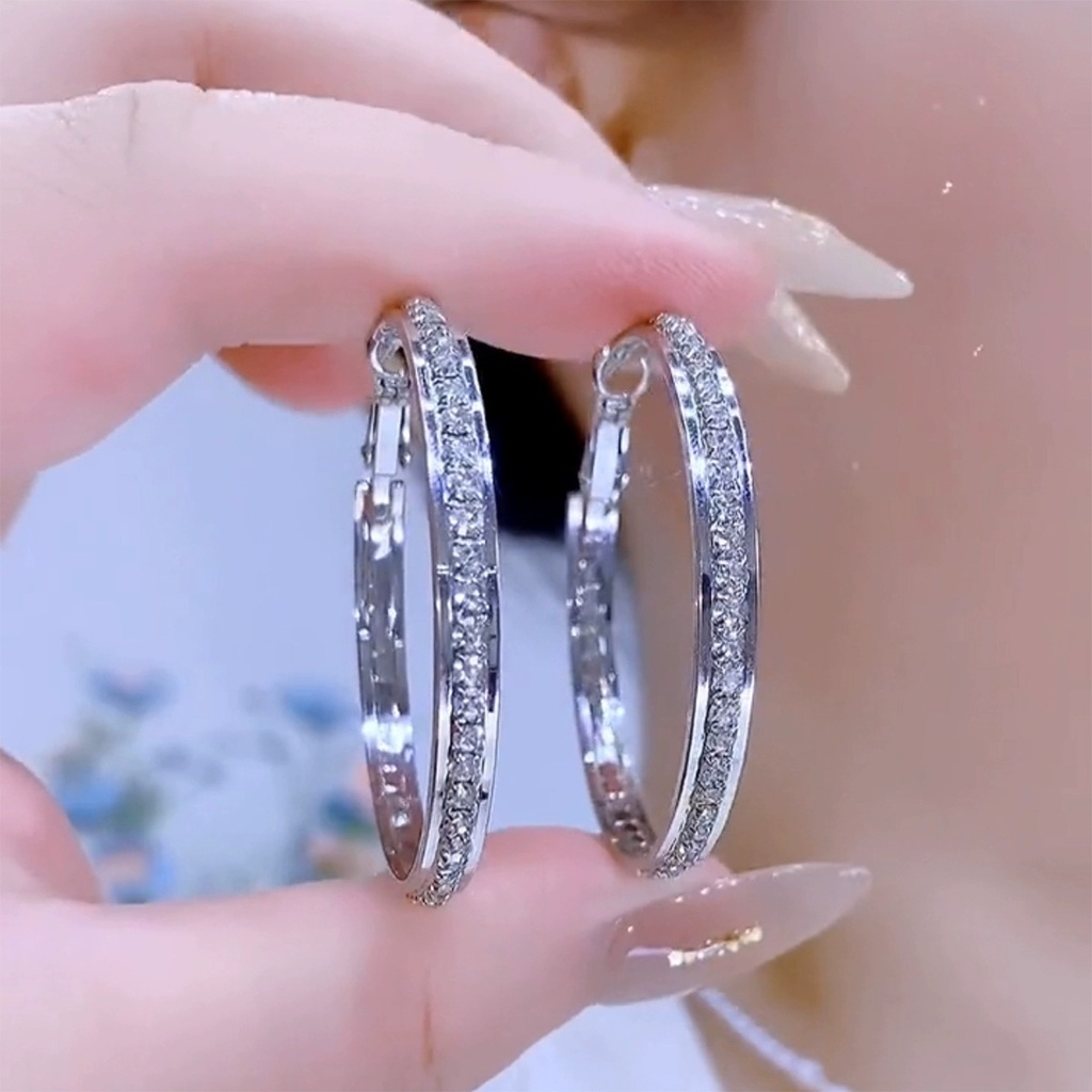 Elegant and trendy earrings adorned with sparkling diamonds, perfect for adding a touch of glamour to any look