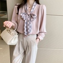 e this autumn with an elegant women's shirt featuring long sleeves, a refined design with a soft bow, and stylish bubble sleeves that add a touch of femininity and uniqueness