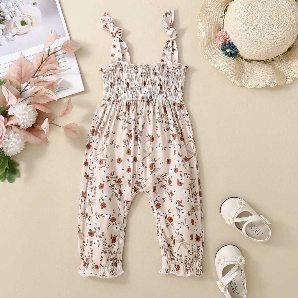 Girls' one-piece floral strap jumpsuit with a stylish design, offering a comfortable and feminine look perfect for everyday wear and special occasions