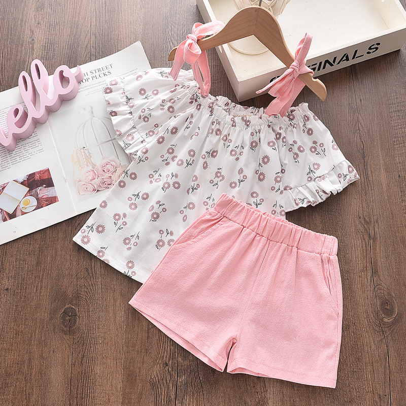 Girls' two-piece floral set featuring a suspender-style top and stylish pants — perfect for a cute and comfortable look