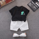 Two-piece kids' outfit – short-sleeve T-shirt with a cartoon dinosaur print paired with matching shorts