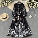 Elegant women's dress with a modern print and a figure-flattering cut