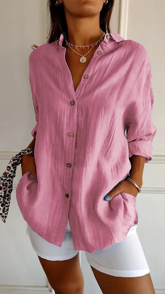 Elegant women's shirt with a classic lapel and long sleeves, featuring a single-breasted design and pleated details that add a refined and feminine touch