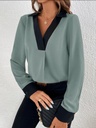 Women's casual blouse/shirt with an elegant design, featuring a V-neckline and contrast color details that add a modern and eye-catching touch