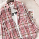 Loose-fit women's plaid shirt with long sleeves, featuring a retro chic design perfect for casual looks
