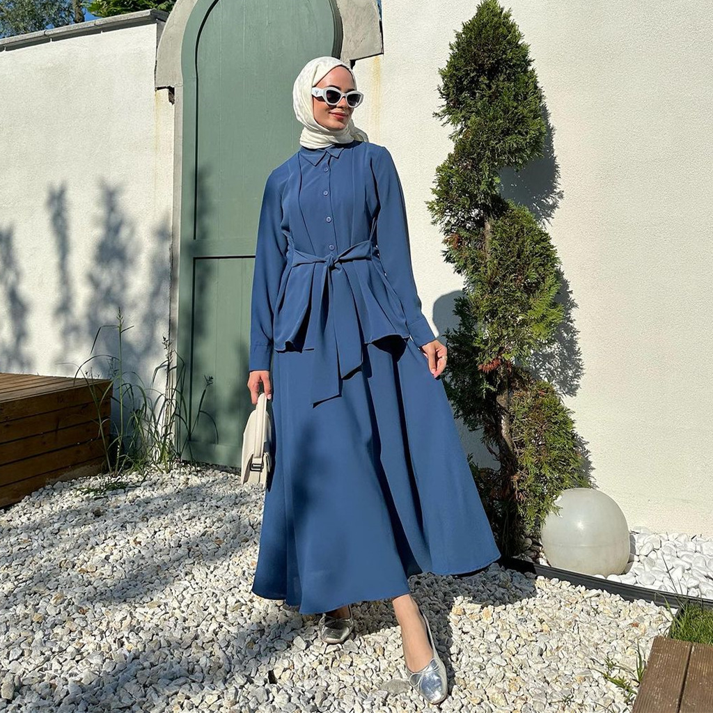 Elegant women's suit with long sleeves and a stylish front tie