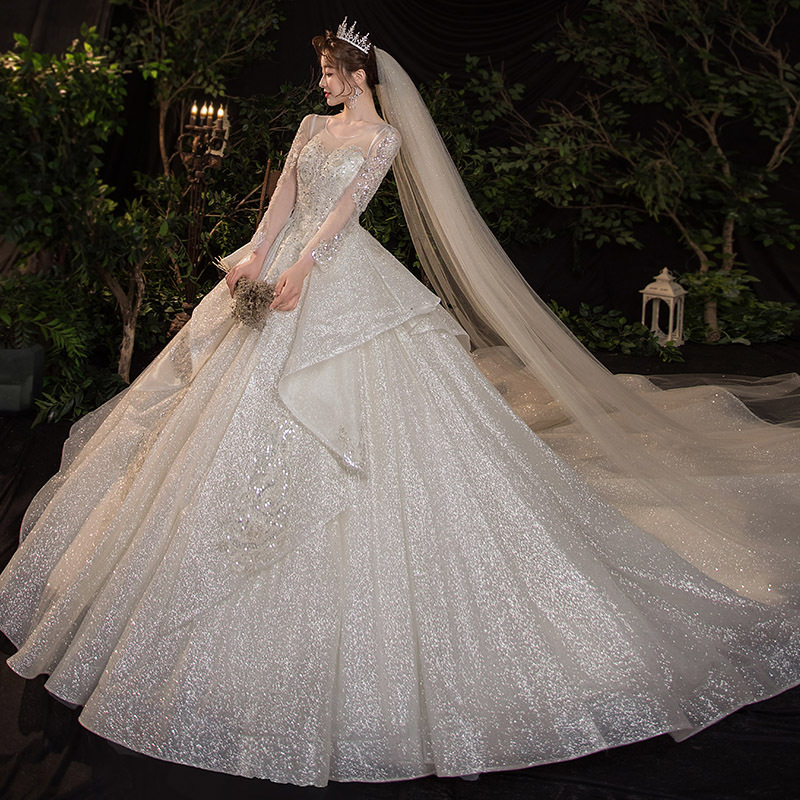 A luxurious wedding dress with an elegant French design, perfect for those seeking a distinctive, royal look