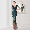 An elegant long evening gown adorned with dazzling floral sequin embellishments
