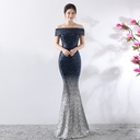 Elegant long evening dress designed to accentuate the figure and provide a charming feminine look