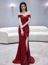 Wine red evening dress with a fishtail cut and an elegant slit