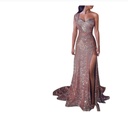 Elegant evening dress with one-shoulder design and shimmering fabric, featuring a side slit for a captivating look