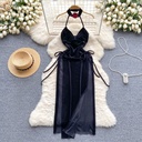 A satin dress featuring a halter neck that combines luxury and comfort in one