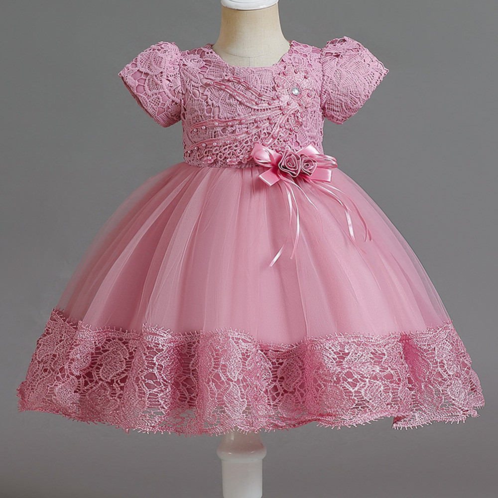 A girls’ dress crafted with exquisite taste, its elegance evident in every detail