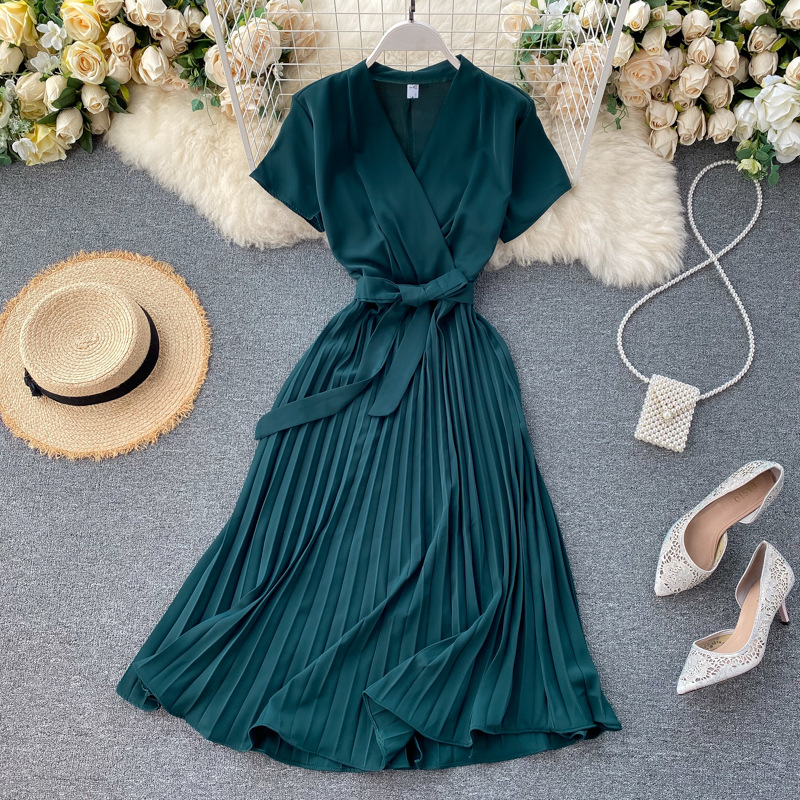 Plain satin V-neck dress with a defined waist and knee-length pleated skirt