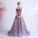 A strapless evening gown adorned with shimmering purple sequins, like a sky full of stars