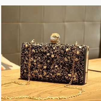 Crystal-embellished evening bag, worn crossbody or carried by hand