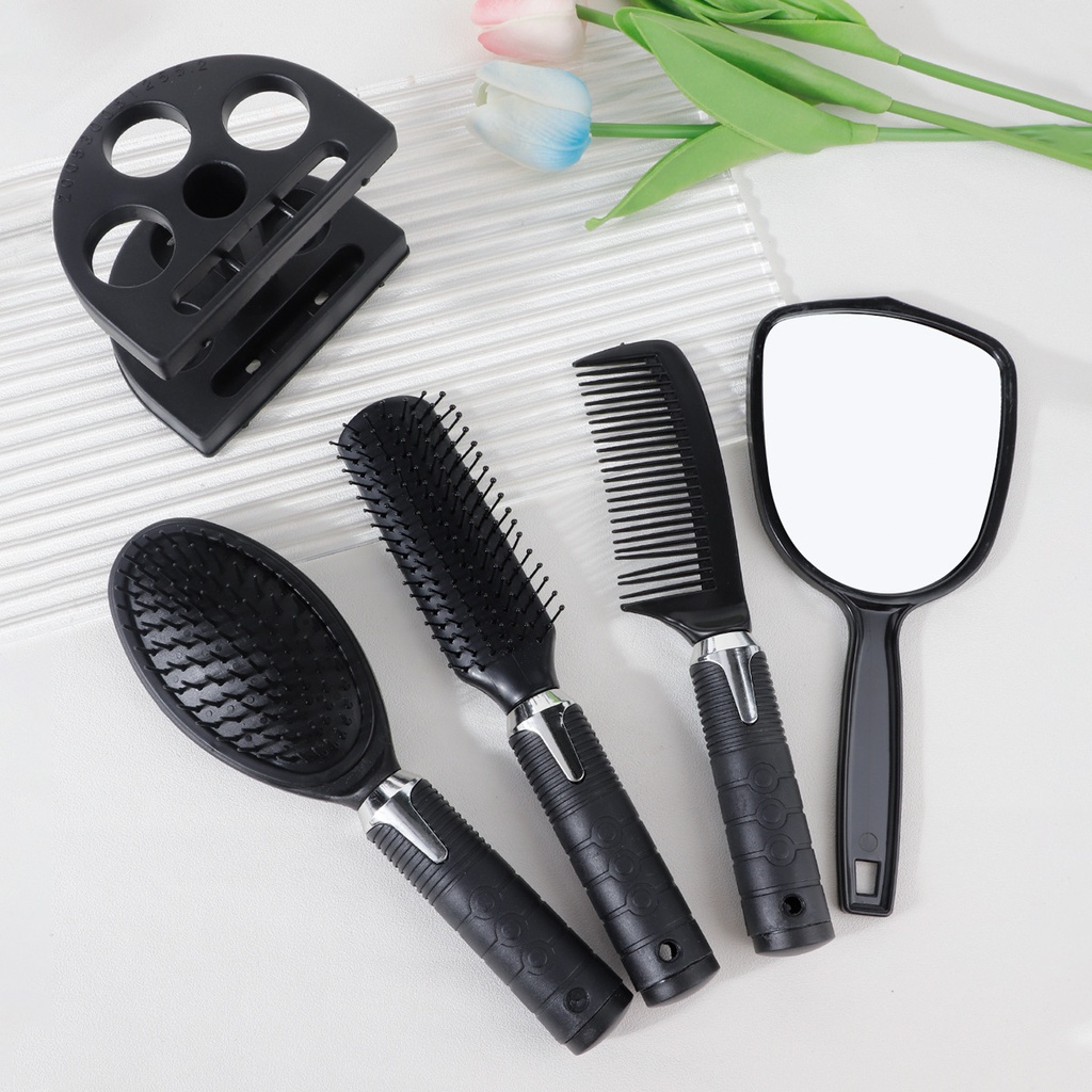4-piece set consisting of: hair curling comb, mirror, and hair styling tools.