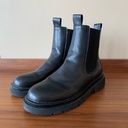 Men's high-top leather boots with a thick sole, featuring a modern design that adds a stylish and elevated look