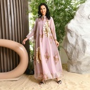 A luxurious and elegant caftan dress, embellished with beads and embroidery, inspired by authentic Arabic heritage