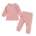Two piece children's suit with striped top and trousers