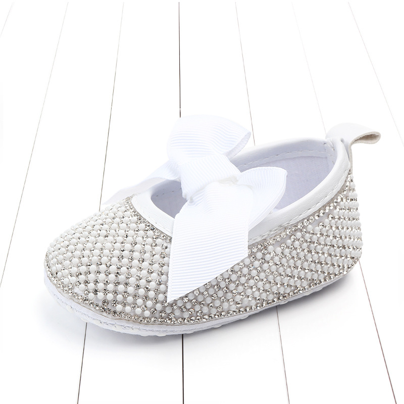 Luxury children's shoes adorned with sparkling crystal stones for an elegant and distinguished look 