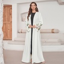 An elegant embroidered cardigan-style dress with long sleeves. 