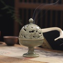 A luxurious ceramic incense burner featuring an elegant design inspired by the classic style