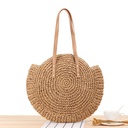 A simple round straw bag with a one-shoulder design, crafted using unique weaving techniques