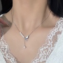 An elegant pearl necklace with a 925 sterling silver bow, featuring a modern and stylish design that adds a sophisticated touch to your look
