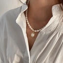 Silver Necklace with Bead and Pearl Art-Shaped Pendant, featuring a unique and modern design to complement your look