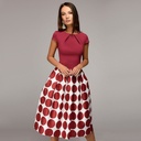 An elegant dress with a unique design and harmonious details that gives you a striking and feminine look