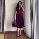 Elegant women's set featuring a sleeveless jacket with a V-neck and a stylish pleated skirt