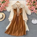 Mid-length dress with a high waist and slimming fit, featuring color-block design and butterfly details for a soft, feminine touch