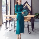 Knitted A-line dress featuring a round neckline and long sleeves, combining elegance and comfort for a perfect look