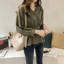 Elegant women's blouse made of cotton and linen, featuring a V-neck and long sleeves with a modern Western design—perfect for everyday looks