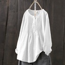 Elegant pullover blouse made from a cotton and linen blend, featuring a simple design with a round neckline for a comfortable and modern everyday look