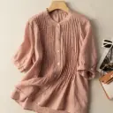 Elegant women's blouse made of soft, high-quality linen, offering a classic look